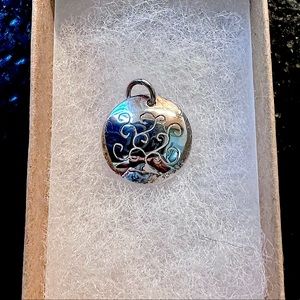 Silver tree of life charm.